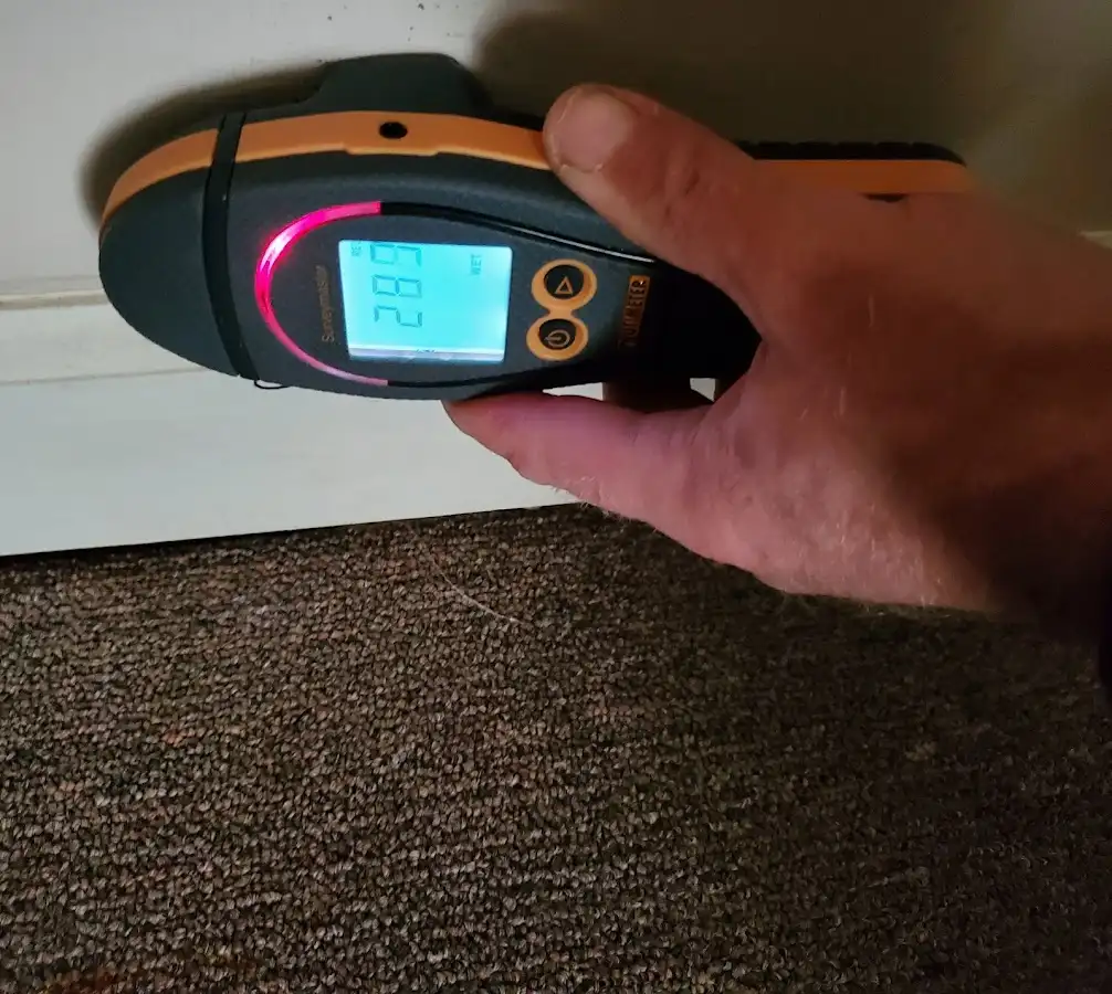 Moisture detection at baseboard during Burst Pipe Cleanup in Byron
